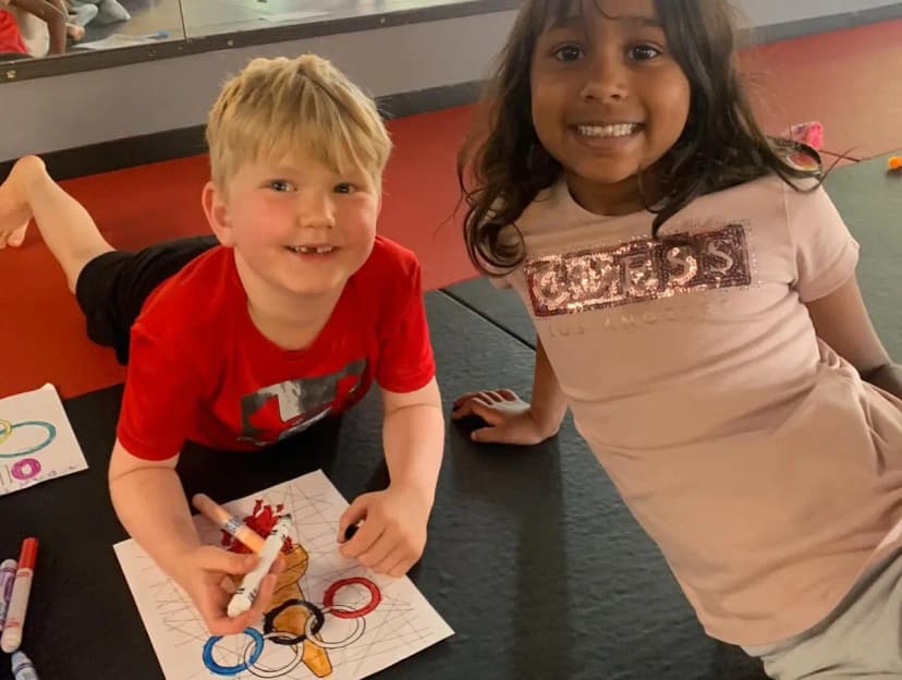 Kids doing arts and crafts at Kaizen MMA summer camp