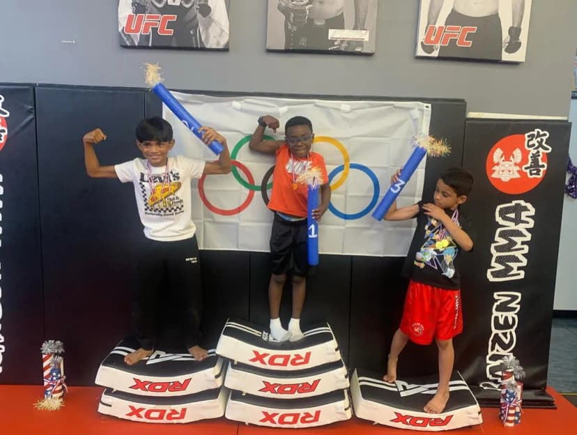 Summer camp kids on Olympic podium with medals