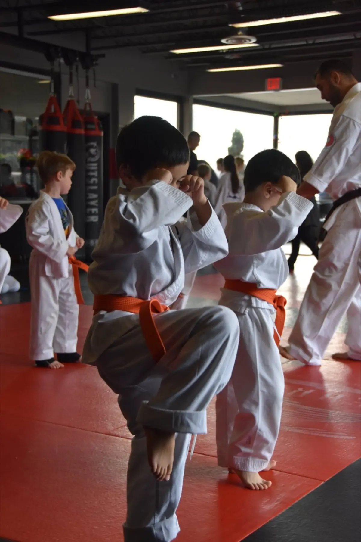 Kids in gis practicing martial arts stance at Kaizen MMA